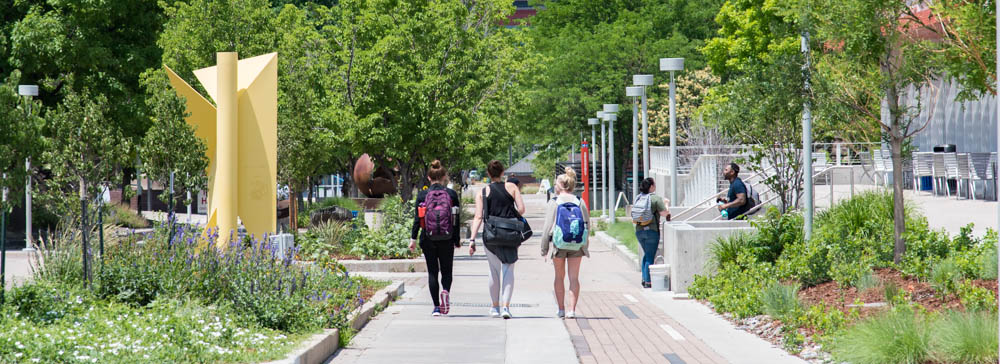 Students walking past the Library towards the Tivoli