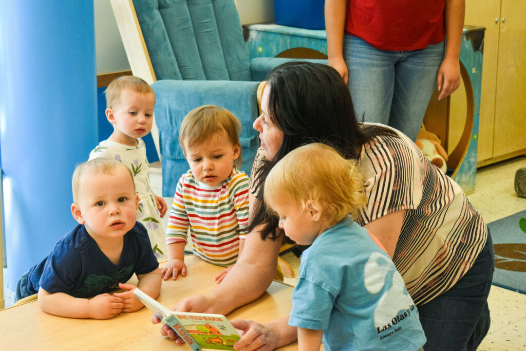 Early Learning Center - Teacher with small group of children at a table