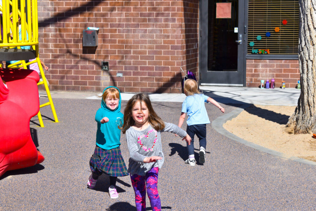 Early Learning Center - Preschool children running on a playground