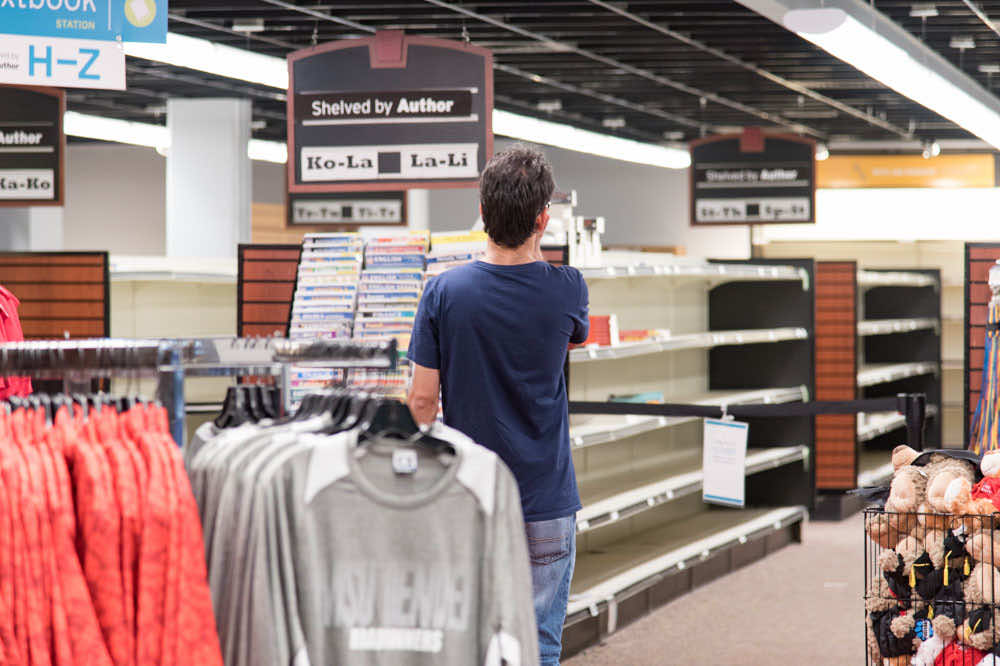 ID Station - Person stocking shelves